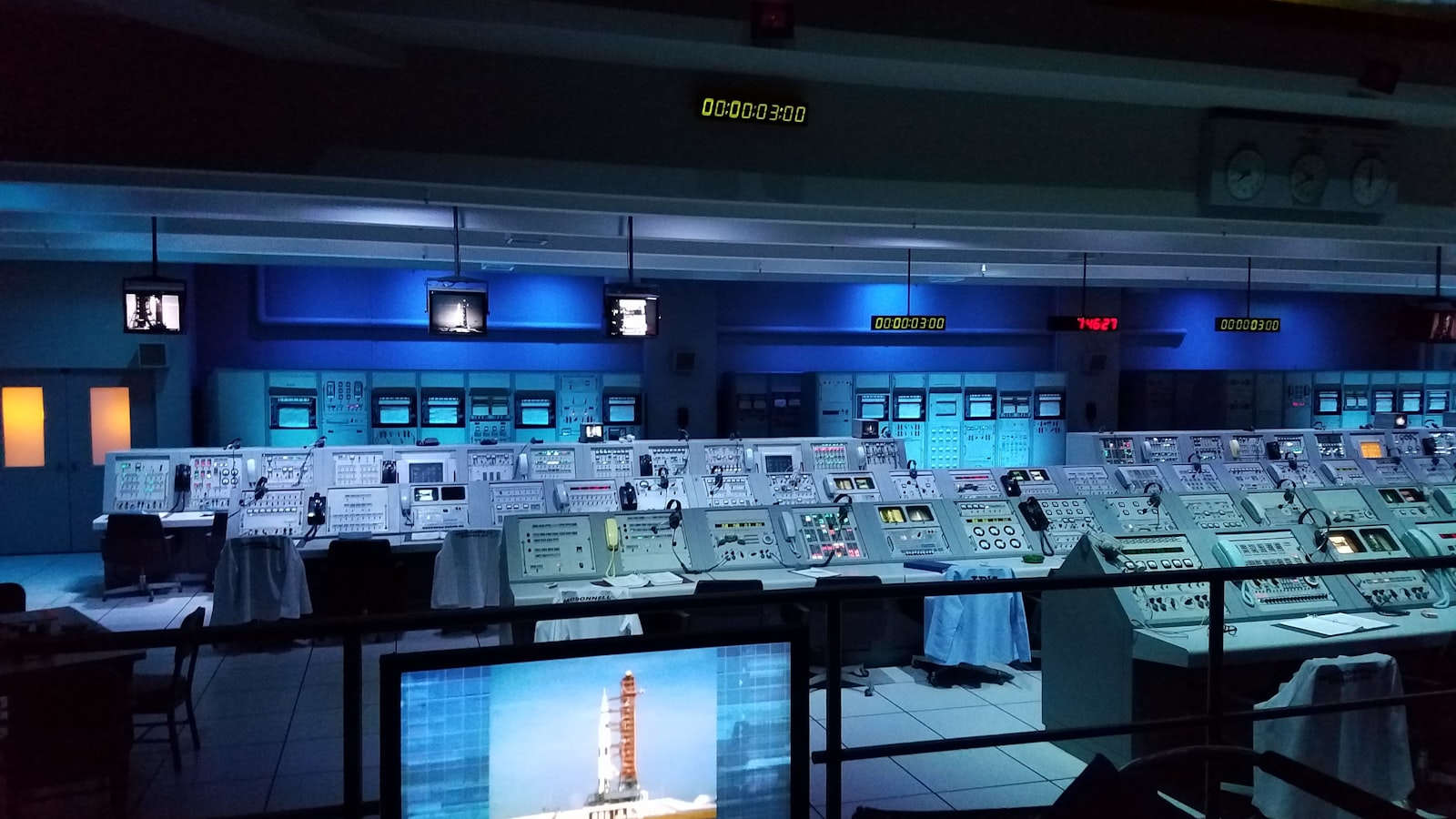 Mission control command center room with rows of consoles, representing a customer support operations command center